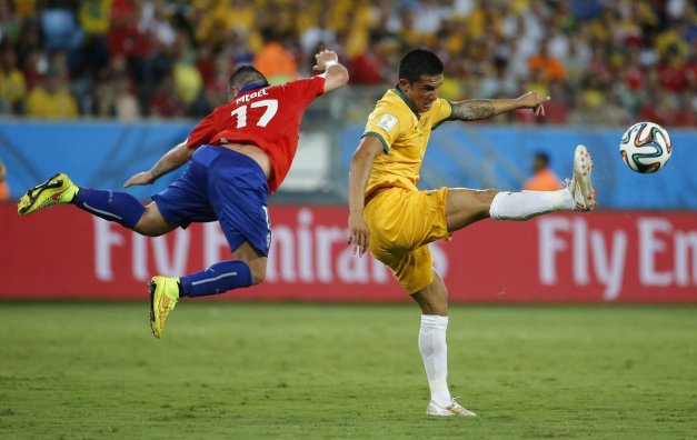 australias-tim-cahill-fights-for-the-ball-in-a-game-against-chile