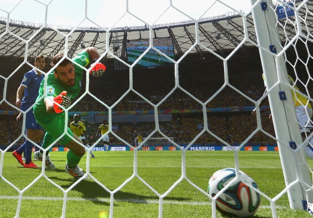goalie-orestis-karnezis-of-greece-watches-a-shot-by-pablo-armero-of-colombia-go-into-his-net