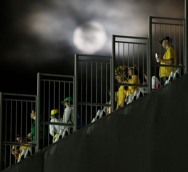 the-moon-shines-bright-as-fans-get-ready-to-leave-the-stadium-after-the-opening-game
